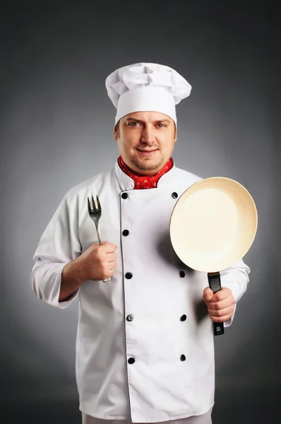 Cook with knife and pan — Stock Photo, Image