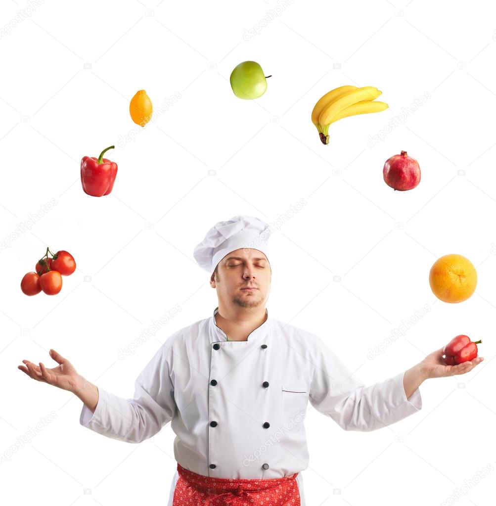 Chef juggles fruit and vegetables