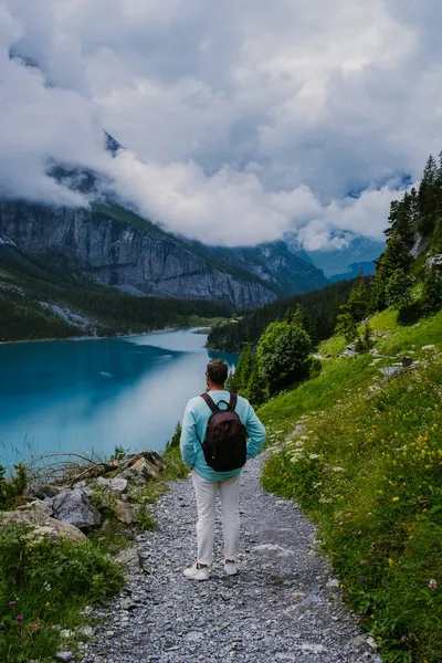 Attractive summer morning on the unique Oeschinensee Lake. Wonderful outdoor scene in the Swiss Alps with Bluemlisalp mountain, Kandersteg village location, Switzerland, Europe — Stock Photo, Image