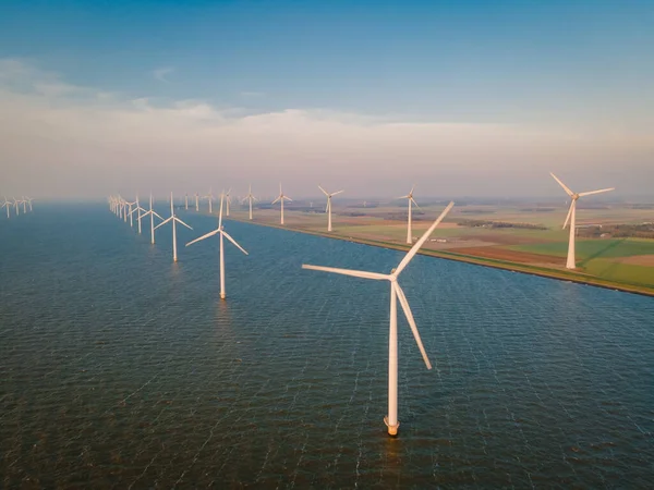 Windmills for electric power production Netherlands Flevoland, Wind turbines farm in sea, windmill farm producing green energy. Netherlands — Stock Photo, Image