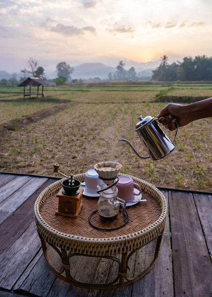 Nan Thailand, drip coffee with a look over the rice fields paddies in the morning during sunrise, coffee in the morning — 스톡 사진