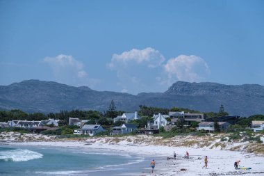 Kommetjie Public Beach Cape Town South Africa, white beach and blue ocean at Kommetjie clipart