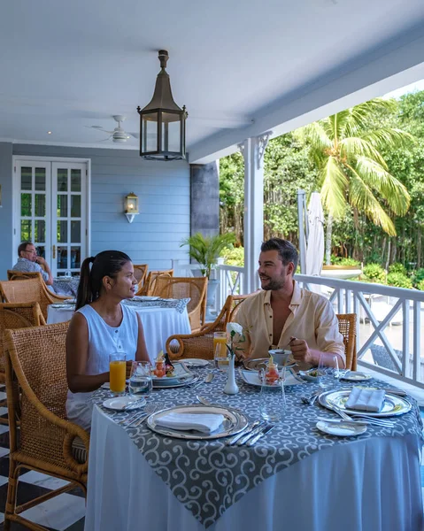 Couple man and woman mid age having breakfast on their balcony of an appartment luxury hotel condo in Mauritius — Photo