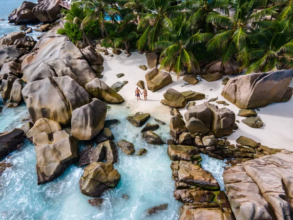 Anse Patates, La Digue Island, Seyshelles, Drone aerial view of La Digue Seychelles bird eye view, mature couple men and women on vacation Seychelles — ストック写真