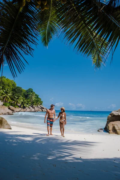 Anse Patates, La Digue Island, Seyshelles, Drone aerial view of La Digue Seychelles bird eye view, mature couple men and women on vacation Seychelles — 图库照片