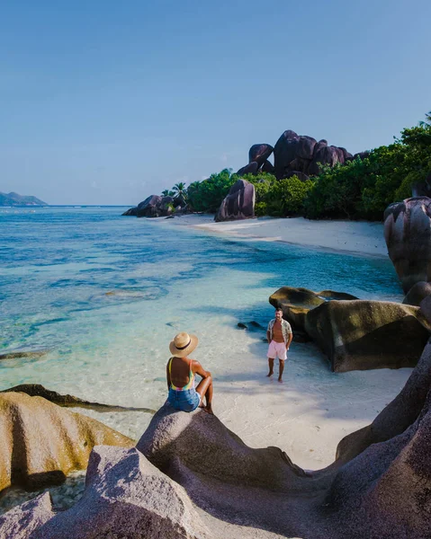 Anse Source dArgent beach, La Digue Island, Seyshelles, Drone aerial view of La Digue Seychelles bird eye view, couple men and woman walking at the beach during sunset at a luxury vacation —  Fotos de Stock
