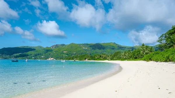 Mahe Seychelles, tropical beach with palm trees and a blue ocean at Mahe Seychelles Anse Royale beach Seychelles Mahe — стокове фото