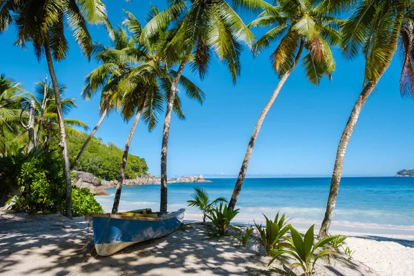Mahe Seychelles, tropical beach with palm trees and a blue ocean at Mahe Seychelles Anse Takamaka beach Mahe Seychelles — Stockfoto