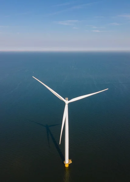 Huge windmill turbines, Offshore Windmill farm in the ocean Westermeerwind park , windmills isolated at sea on a beautiful bright day Netherlands Flevoland Noordoostpolder — Stock Photo, Image