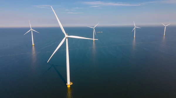 Huge windmill turbines, Offshore Windmill farm in the ocean Westermeerwind park , windmills isolated at sea on a beautiful bright day Netherlands Flevoland Noordoostpolder — Photo