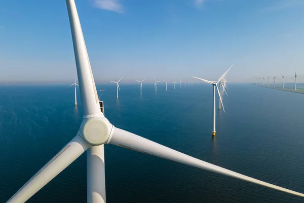 Huge windmill turbines, Offshore Windmill farm in the ocean Westermeerwind park , windmills isolated at sea on a beautiful bright day Netherlands Flevoland Noordoostpolder — Stock Photo, Image