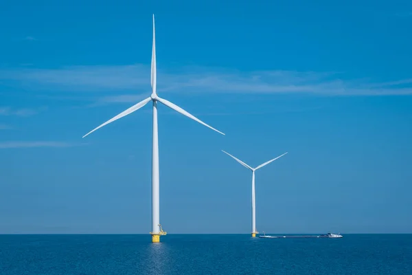 Huge windmill turbines, Offshore Windmill farm in the ocean Westermeerwind park , windmills isolated at sea on a beautiful bright day Netherlands Flevoland Noordoostpolder — Stockfoto