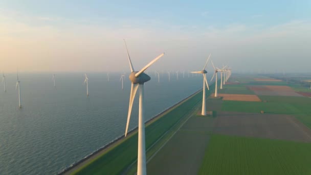 Huge windmill turbines, Offshore Windmill farm in the ocean Westermeerwind park , windmills isolated at sea on a beautiful bright day Netherlands Flevoland Noordoostpolder — Vídeo de stock