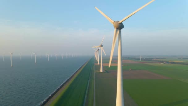 Huge windmill turbines, Offshore Windmill farm in the ocean Westermeerwind park , windmills isolated at sea on a beautiful bright day Netherlands Flevoland Noordoostpolder — Stock Video
