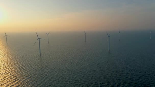 Huge windmill turbines, Offshore Windmill farm in the ocean Westermeerwind park , windmills isolated at sea on a beautiful bright day Netherlands Flevoland Noordoostpolder — Vídeo de stock