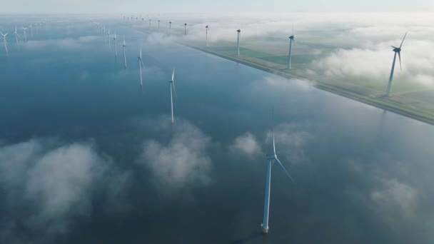 Huge windmill turbines, Offshore Windmill farm in the ocean Westermeerwind park , windmills isolated at sea on a beautiful bright day Netherlands Flevoland Noordoostpolder — Stock Video