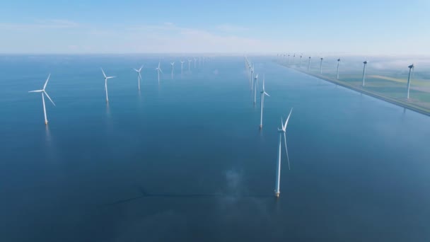 Huge windmill turbines, Offshore Windmill farm in the ocean Westermeerwind park , windmills isolated at sea on a beautiful bright day Netherlands Flevoland Noordoostpolder — Stockvideo