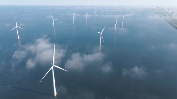 Huge windmill turbines, Offshore Windmill farm in the ocean Westermeerwind park , windmills isolated at sea on a beautiful bright day Netherlands Flevoland Noordoostpolder — Video Stock