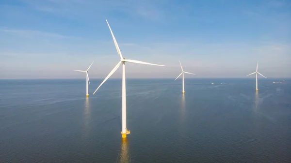 Huge windmill turbines, Offshore Windmill farm in the ocean Westermeerwind park , windmills isolated at sea on a beautiful bright day Netherlands Flevoland Noordoostpolder — Stockfoto