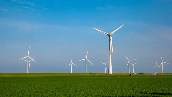 Huge windmill turbines, Offshore Windmill farm in the ocean Westermeerwind park , windmills isolated at sea on a beautiful bright day Netherlands Flevoland Noordoostpolder — 스톡 사진