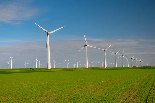 Huge windmill turbines, Offshore Windmill farm in the ocean Westermeerwind park , windmills isolated at sea on a beautiful bright day Netherlands Flevoland Noordoostpolder — 스톡 사진