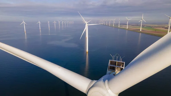Huge windmill turbines, Offshore Windmill farm in the ocean Westermeerwind park , windmills isolated at sea on a beautiful bright day Netherlands Flevoland Noordoostpolder — Stock Photo, Image