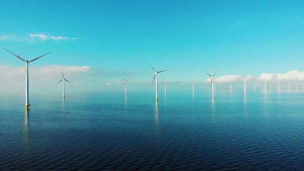 Windmill park in the ocean, drone aerial view of windmill turbines generating green energy electric, windmills isolated at sea in the Netherlands — Stock Video
