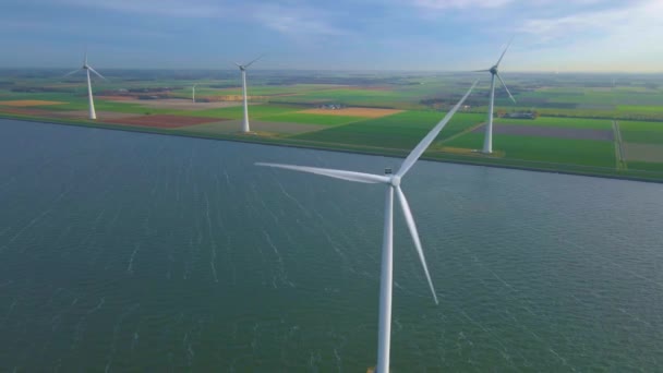 Windmill park in the ocean, drone aerial view of windmill turbines generating green energy electric, windmills isolated at sea in the Netherlands — Stock Video