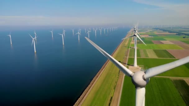 Windmill park in the ocean, drone aerial view of windmill turbines generating green energy electric, windmills isolated at sea in the Netherlands — Stock Video
