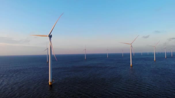 Windmill park in the ocean, drone aerial view of windmill turbines generating green energy electric, windmills isolated at sea in the Netherlands — Stock Video