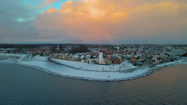 Urk Flevoland Netherlands a sunny snow winter day at the old village of Urk with fishing boats at the harbor — Stock Video