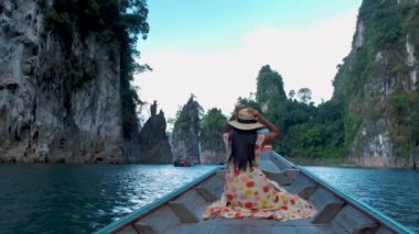 Khao Sok Thailand, woman on vacation in Thailand, girl in longtail boat at the Khao Sok national park Thailand