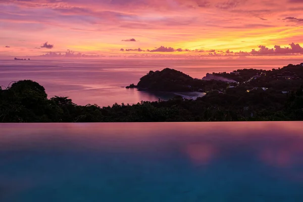 luxury vacation in Thailand pool of a luxury pool villa, swimming pool during vacation at the tropical islands Infinity pool during sunset