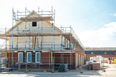 Yeni bir ev inşaatı, modern aile evleri olan Hollanda Suburban bölgesi, Hollanda 'da yeni inşa edilmiş modern aile evleri, Hollanda aile evleri., 