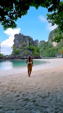Koh Hong Island Krabi Thailand, women on the beach of Koh Hong, a tropical white beach with Asian women in Krabi Thailand