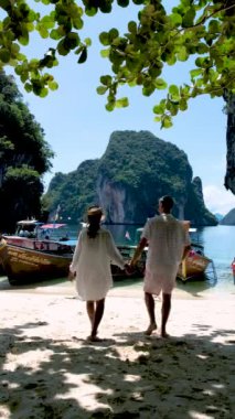 Koh Hong Island Krabi Thailand, a couple of men and women on a tropical beach in Thailand. slow motion of a couple walking at a beach in Thailand Krabi Koh La Landing