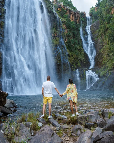 Panorama Route South Africa, Lisbon Falls South Africa, Lisbon Falls is the highest waterfall in Mpumalanga, South Africa. Asian women and caucasian men on vacation in South Africa