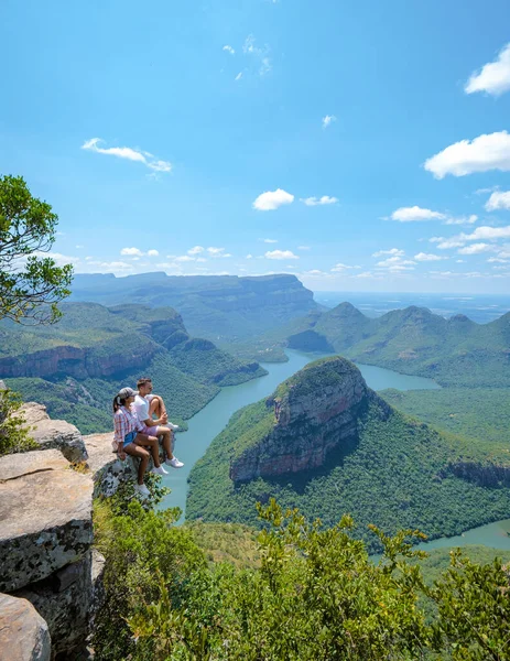 Panorama Route South Africa, Blyde river canyon with the three rondavels, view of three rondavels and the Blyde river canyon in South Africa. Asian women and Caucasian men on vacation in South Africa