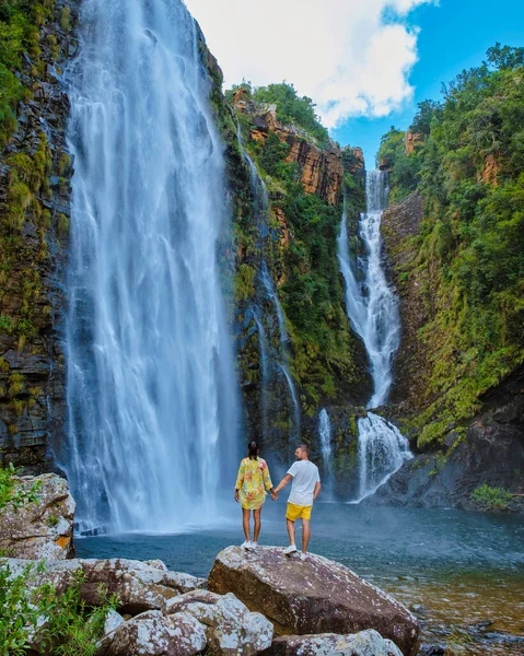 Panorama Route South Africa, Lisbon Falls South Africa, Lisbon Falls is the highest waterfall in Mpumalanga, South Africa. Asian women and caucasian men on vacation in South Africa