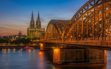 Cologne Koln Germany during sunset, Cologne bridge with the cathedral. beautiful sunset at the Rhine river