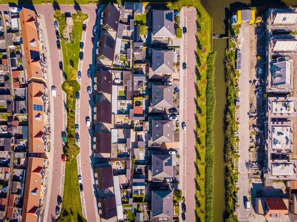 Dutch Suburban area with modern family houses, newly build modern family homes in the Netherlands, dutch family houses in the Netherlands, newly build streets with modern houses.