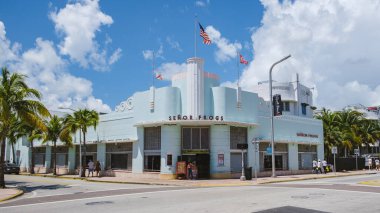 Little Havana Miami Florida April 2019, colorful Streets of Little Havana in Miami with art on the walls. men having a ice cream during summer
