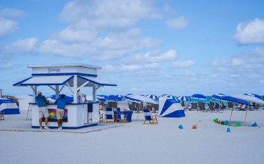 Miami Beach Florida May 2022 colorful beach with umbrellas and beach huts. 