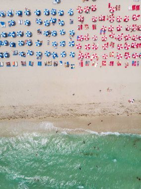 Drone aerial view at Miami South Beach Florida. Beach with colorful chairs and umbrellas, top view of the beach Miami Florida