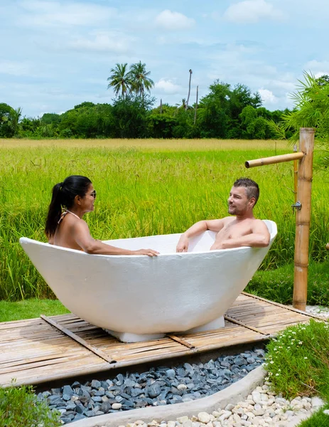 Couple Men Women White Bathtub Looking Out Green Rice Field — Photo