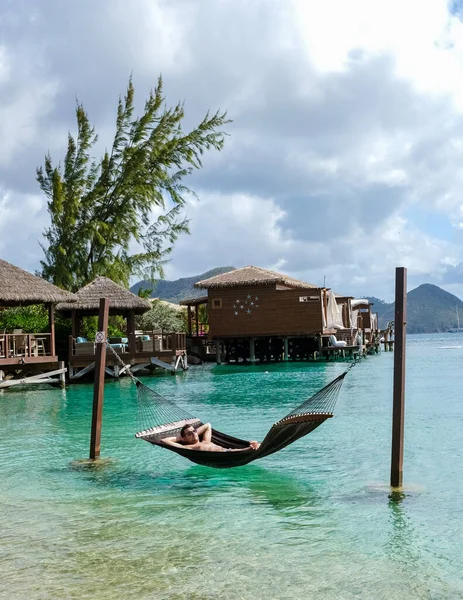 Young Men Hammocks Ocean Beach Tropical Island Caribbean Luxury Holiday — Stockfoto