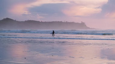 Tofino Vancouver Island Pacific rim coast, surfers with surfboard during sunset at the beach, surfers silhouette Canada Vancouver Island Tofino Vancouver Islander Island 