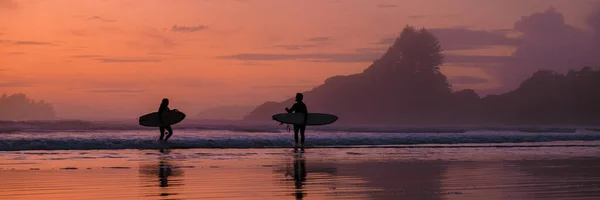 Tofino Vancouver Island Pacific rim coast, surfers with surfboard during sunset at the beach, surfers silhouette Canada Vancouver Island Tofino Vancouver Islander Island