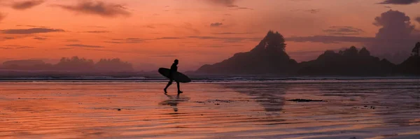 Tofino Vancouver Island Pacific rim coast, surfers with surfboard during sunset at the beach, surfers silhouette Canada Vancouver Island Tofino Vancouver Islander Island