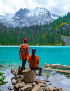 Joffre Lakes British Colombia Whistler Canada, colorful lake of Joffre lakes national park in Canada. Couple of Asian women and caucasian men walking at Jofre Lake BC Canada